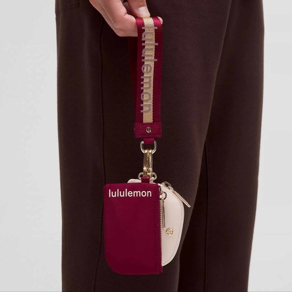 76💕🆕 Lululemon Dual Pouch Wristlet Wordmark - Deep Luxe Gold Bone - Picture 1 of 7
